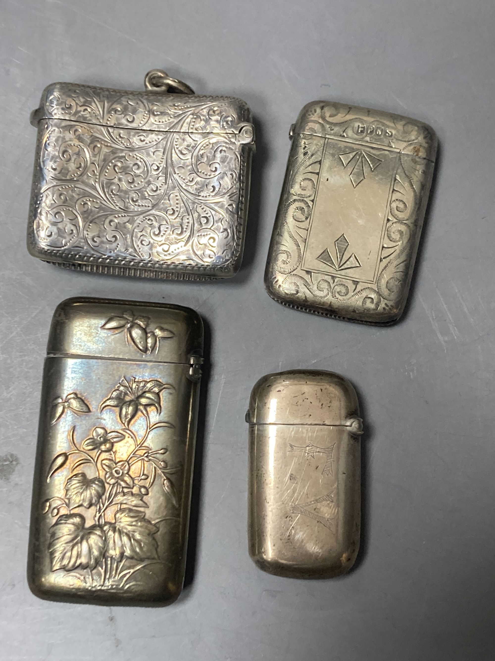 A silver cigarette box, silver cigarette case, four vestas including two silver, a continental dish and a toilet jar.